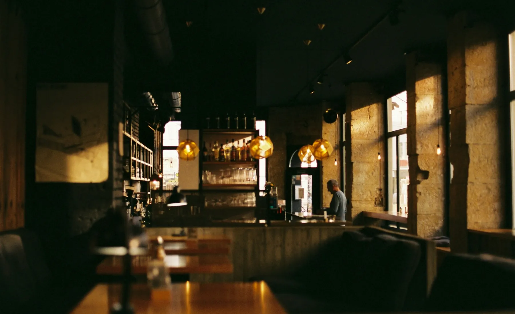 A dimly lit restaurant with warm lights