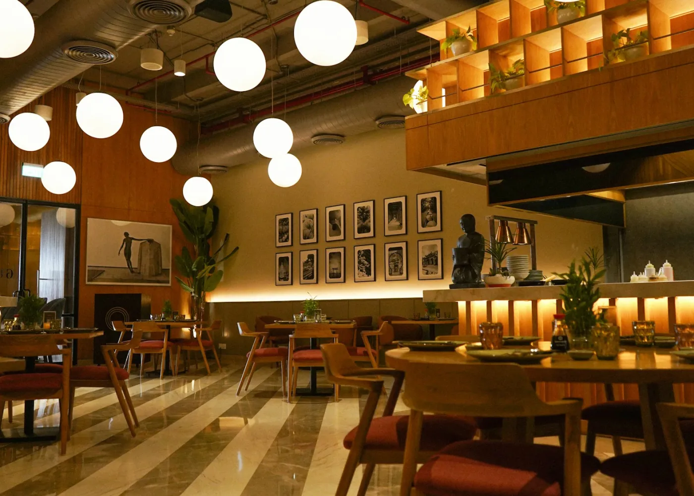 Warm pendant lights above tables